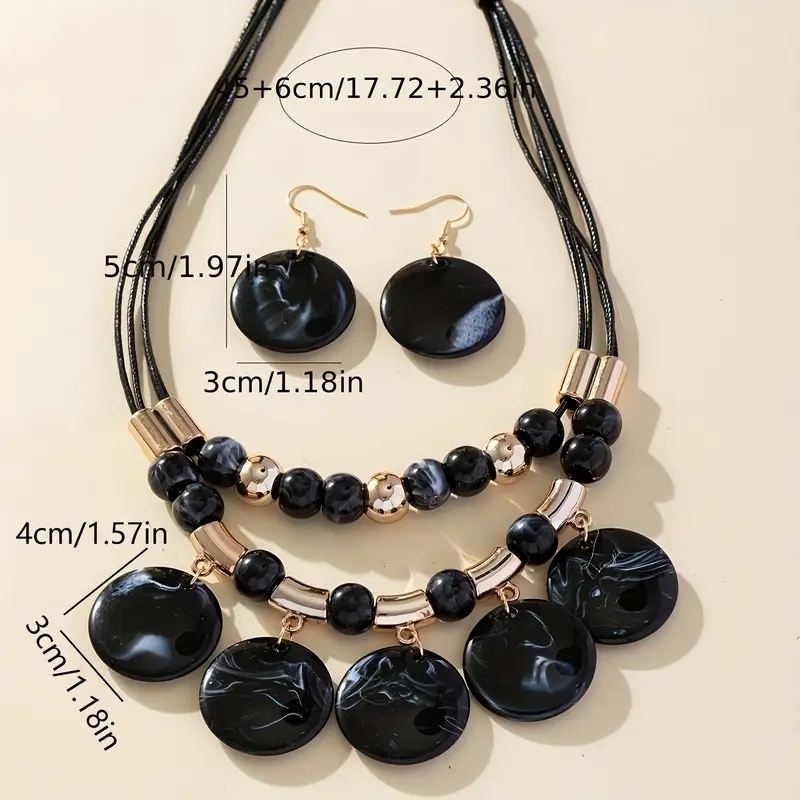 Siyah%20Kolye%20ve%20Küpe%20Seti%20Zarafet%20ve%20Güç%20Sembolü